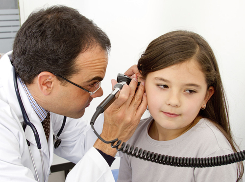 Pediatrician checking a patient